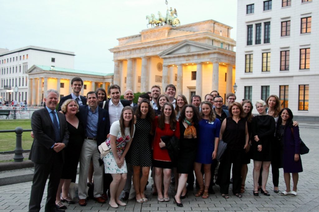 Group of MAGES alumni in front of the Brandenburger Gate